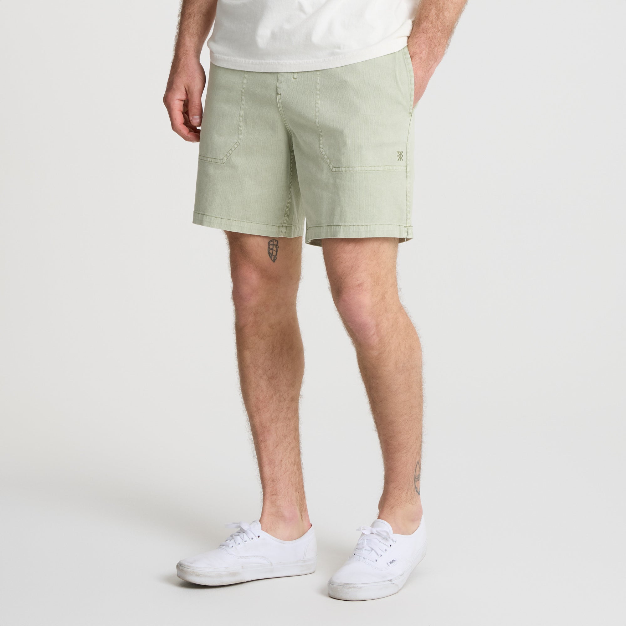 Bermuda shorts ideal for adventure and travel by Roark, styled in a natural outdoor setting