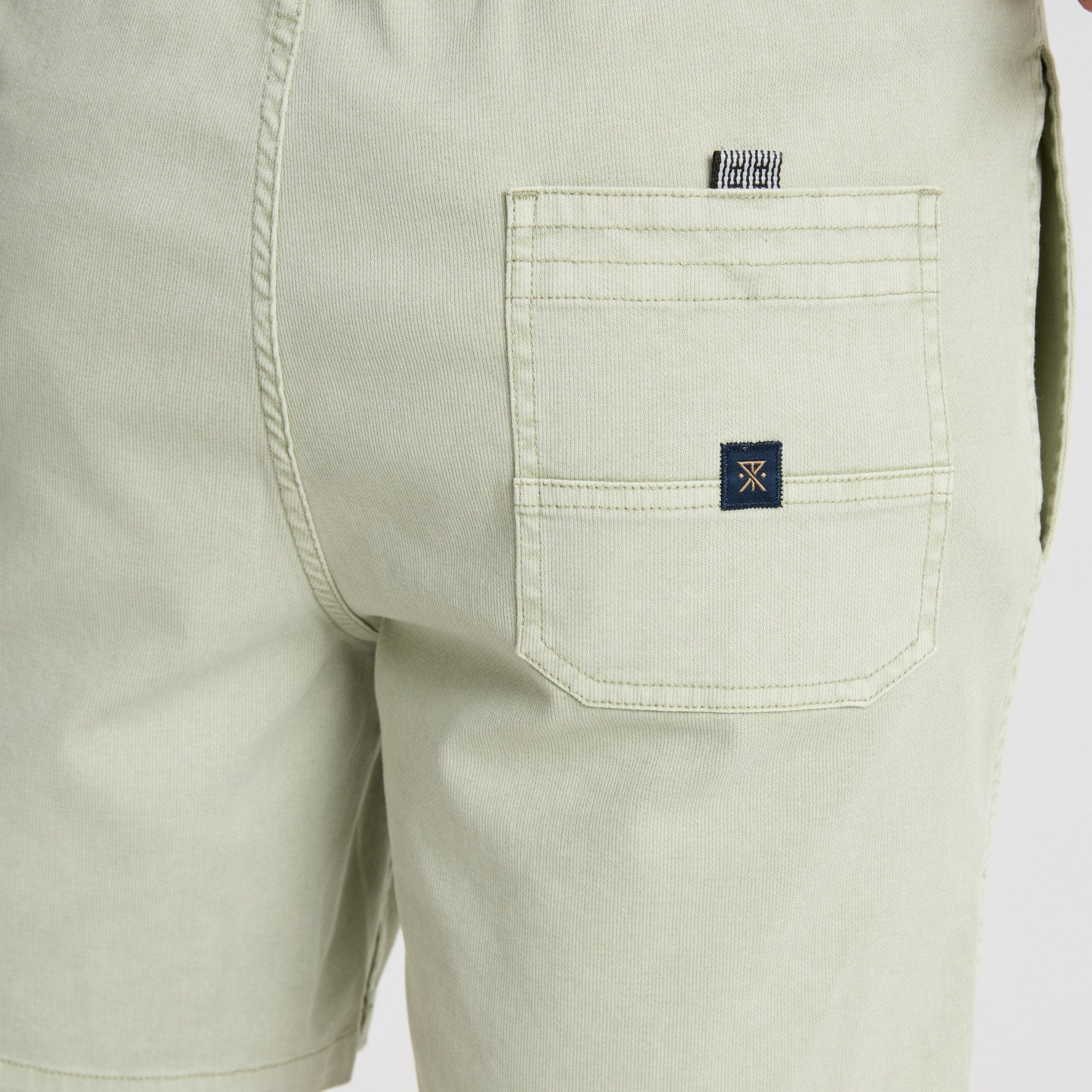 Adventure-ready Roark traveler enjoying a serene waterside sunset