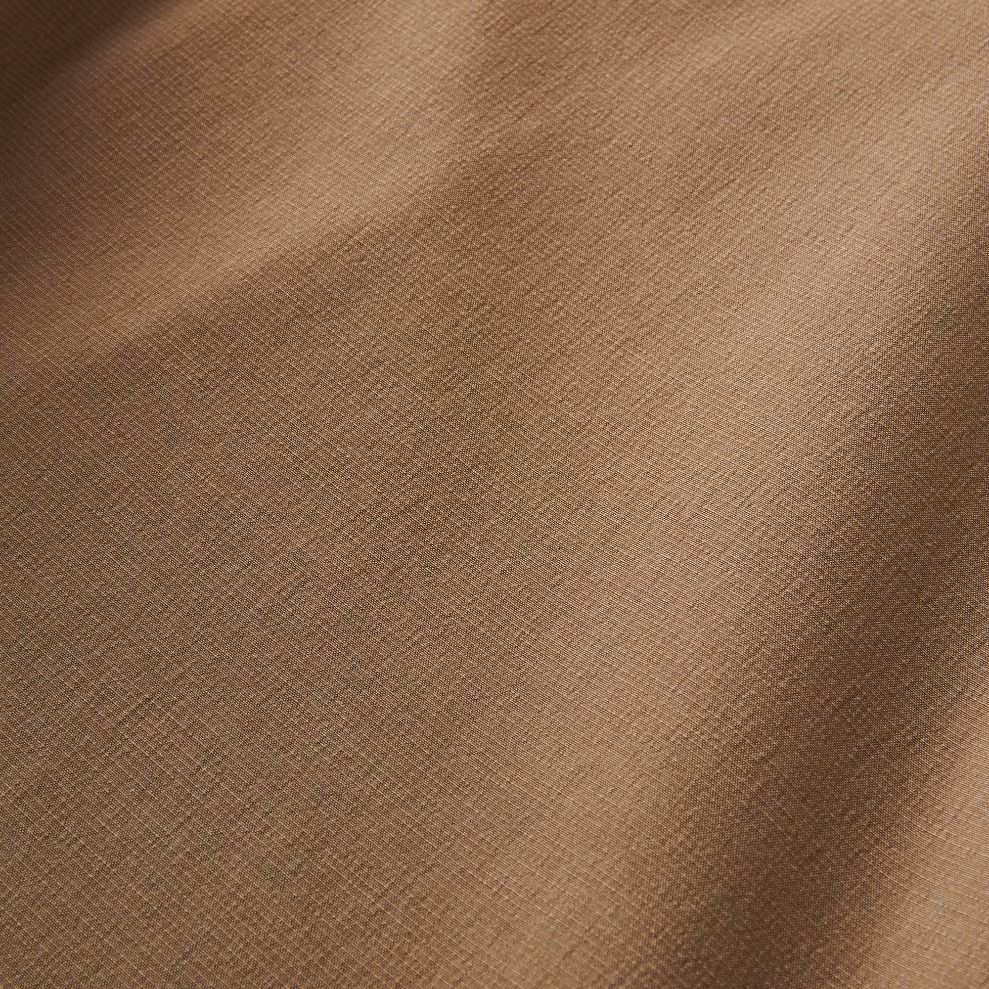 Detailed fabric texture of Roark Hy-Tide Hybrid Short in dark khaki, emphasizing its wicking technology and engineered fabric.