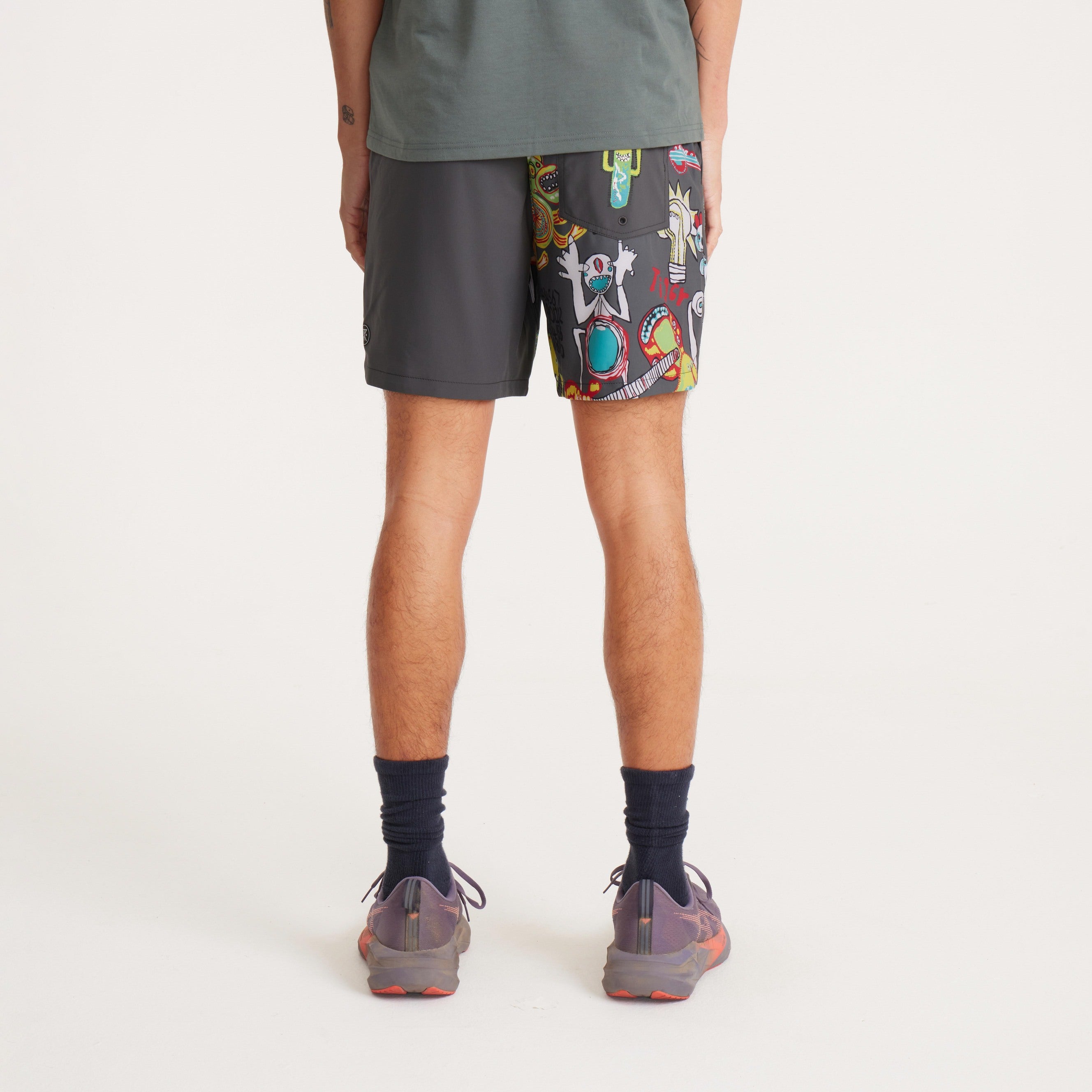 Back view of men's swim shorts with vibrant designs, zippered back pocket, and quick-dry material for beach and outdoor use.