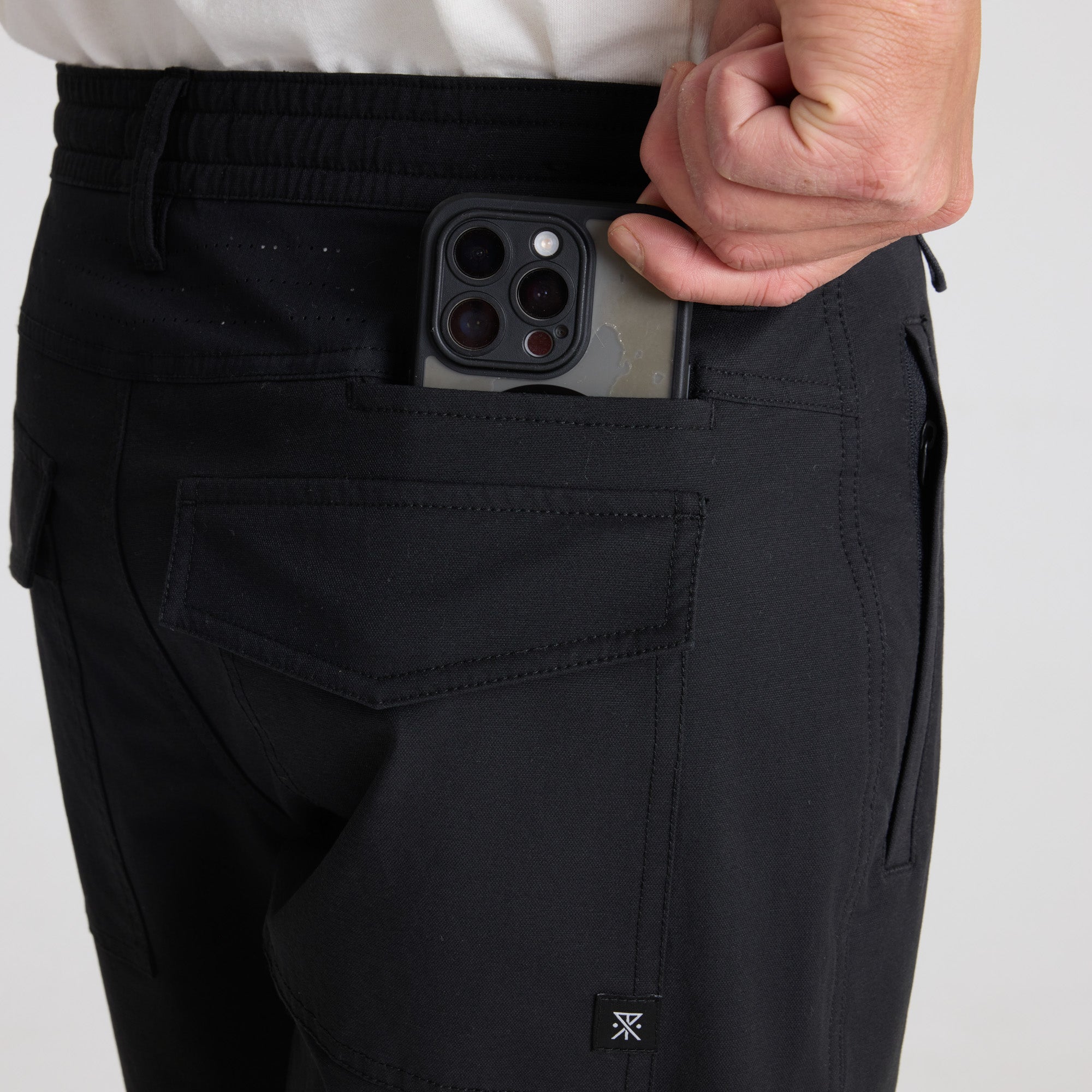 Versatile black cargo active pants perfect for adventure and travel by Roark