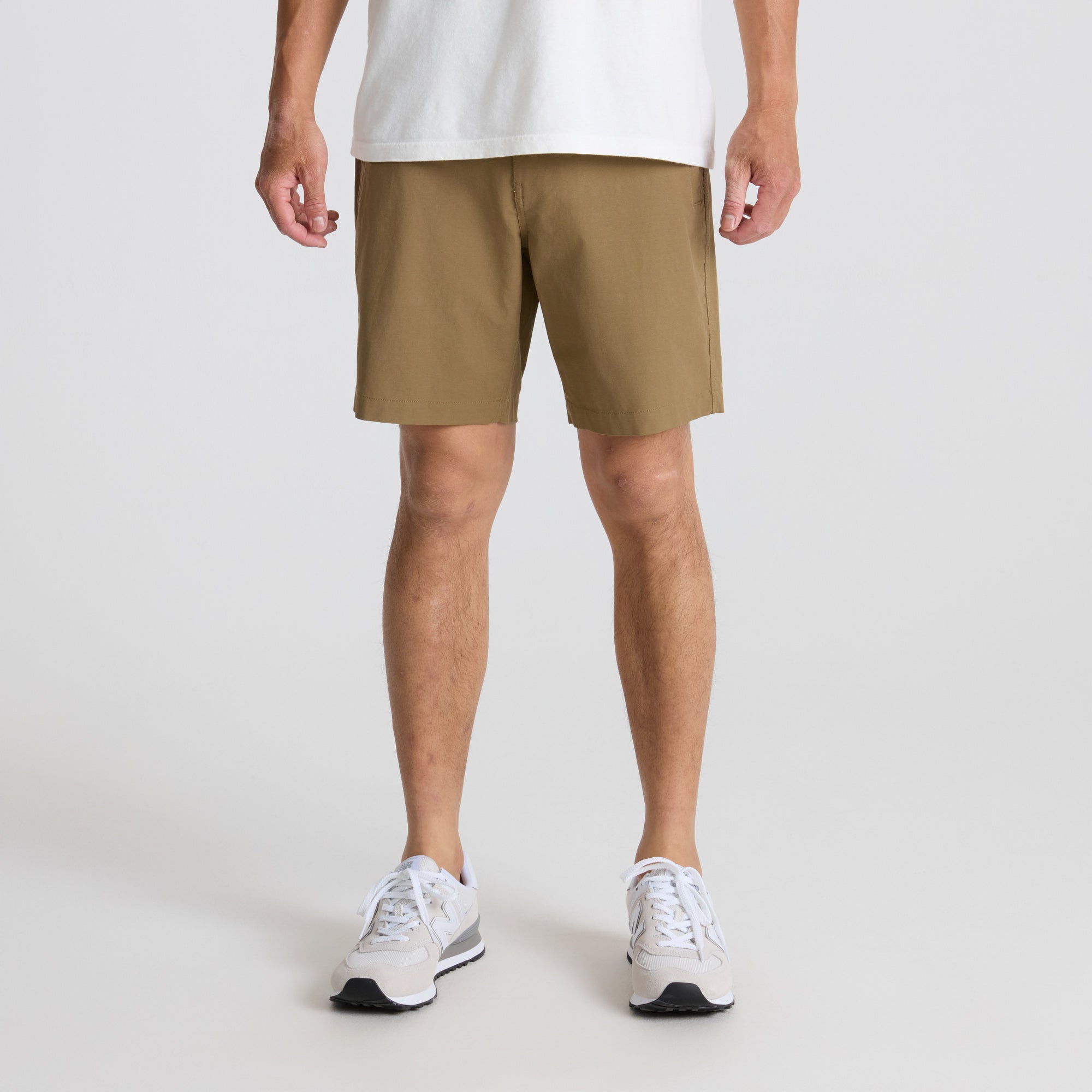 Active man in dark Bermuda shorts on a travel adventure, showcasing Roark's practical and stylish outdoor attire.