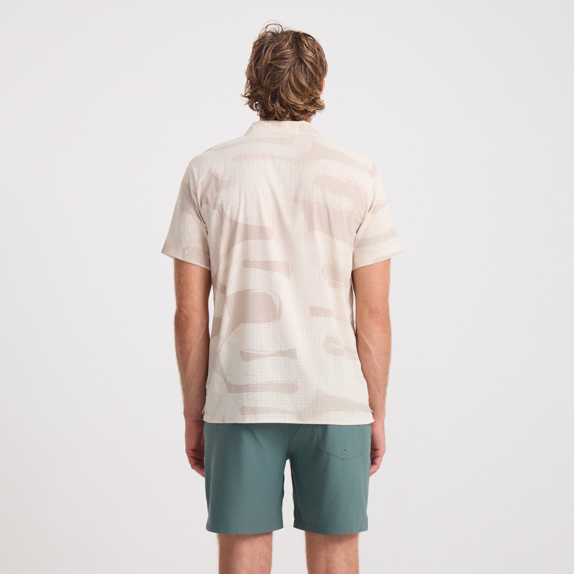 Active outdoor shirt designed for adventure and travel, featuring a durable and breathable fabric, perfect for exploring or casual wear.