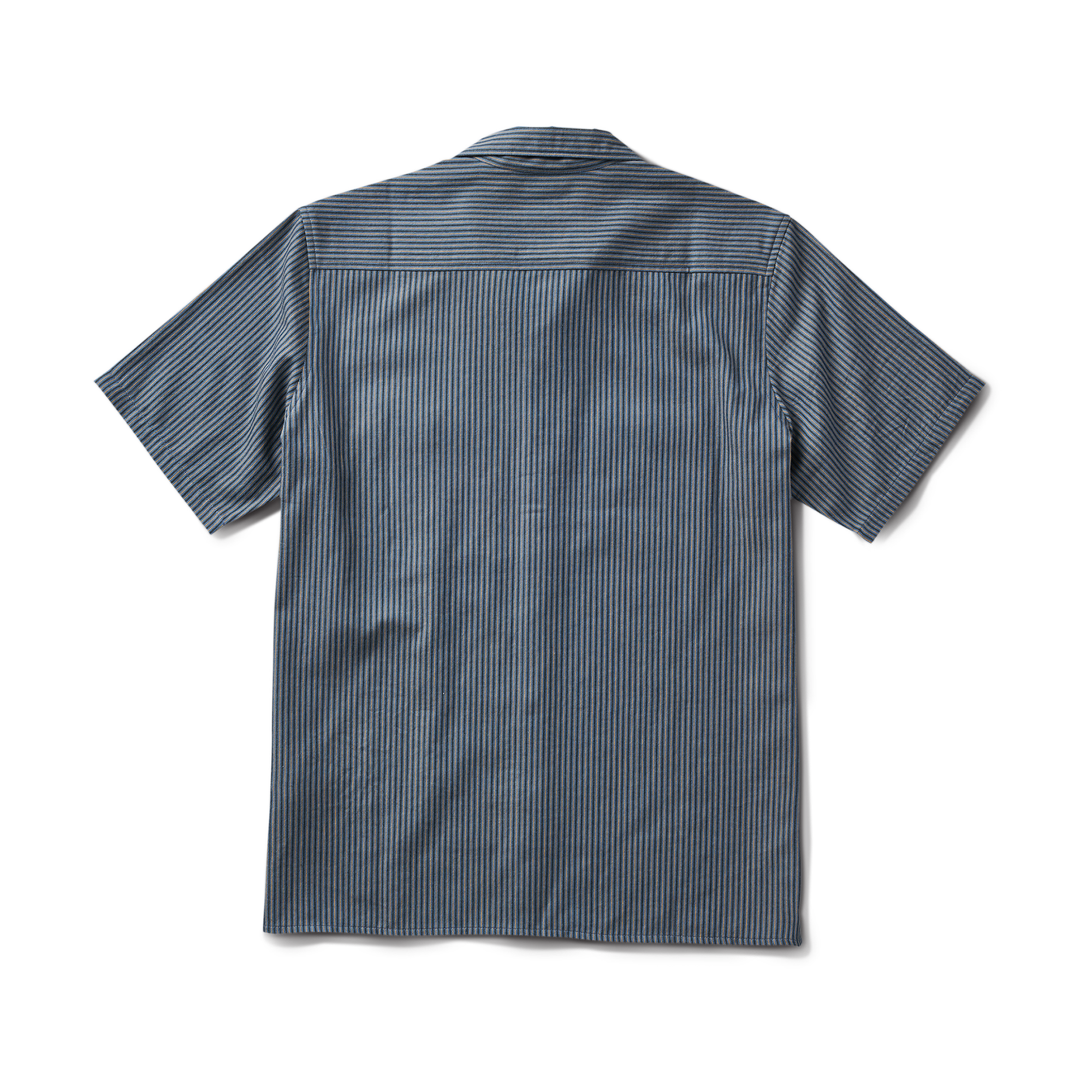 Close-up of a durable Roark adventure dress shirt featuring prominent buttons, a practical pocket, and designed sleeves for outdoor activities.