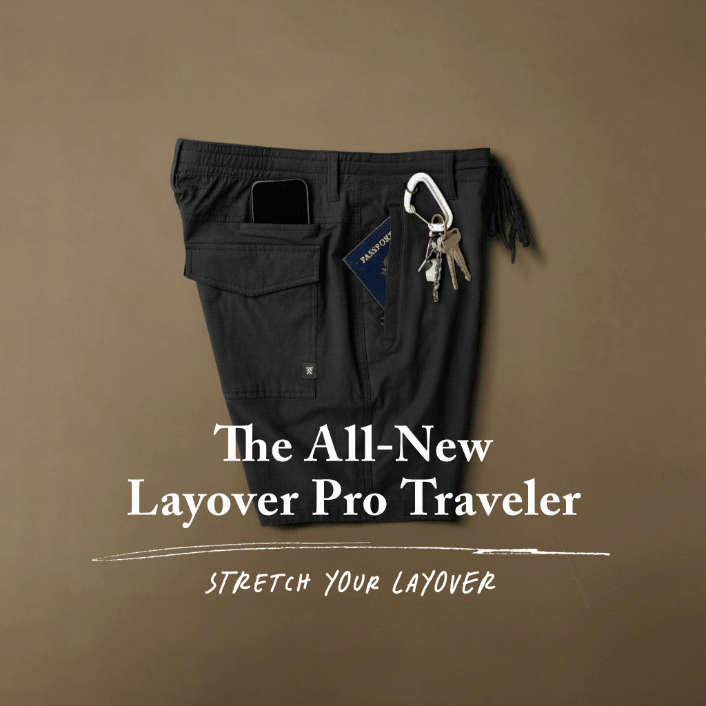 Black travel pants with keys on a brown background, featuring text 'The All-New Layover Pro Traveler'.