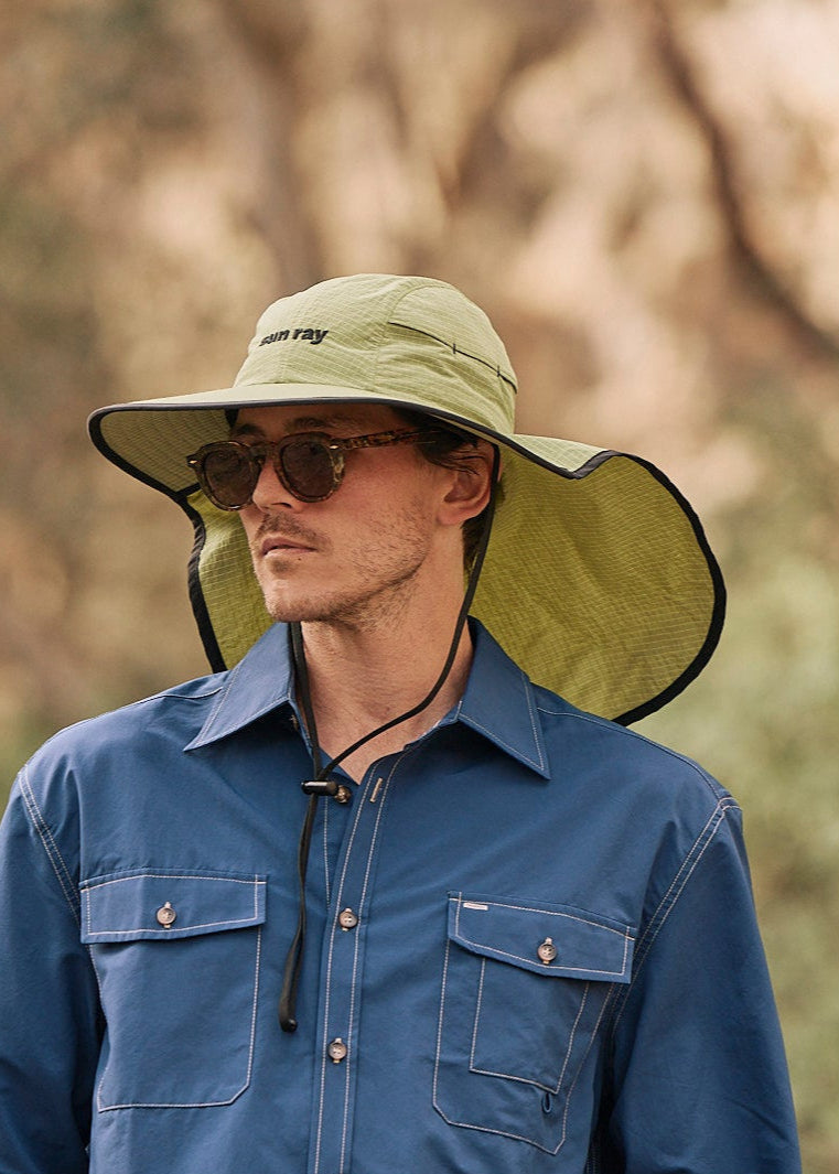 Person wearing a sun ray green sun protection UPF50+ seriously shady hat with neck cover