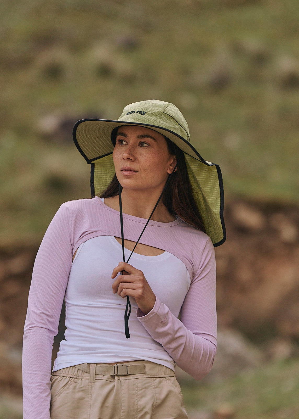 Person wearing a sun ray green sun protection UPF50+ seriously shady hat with neck cover