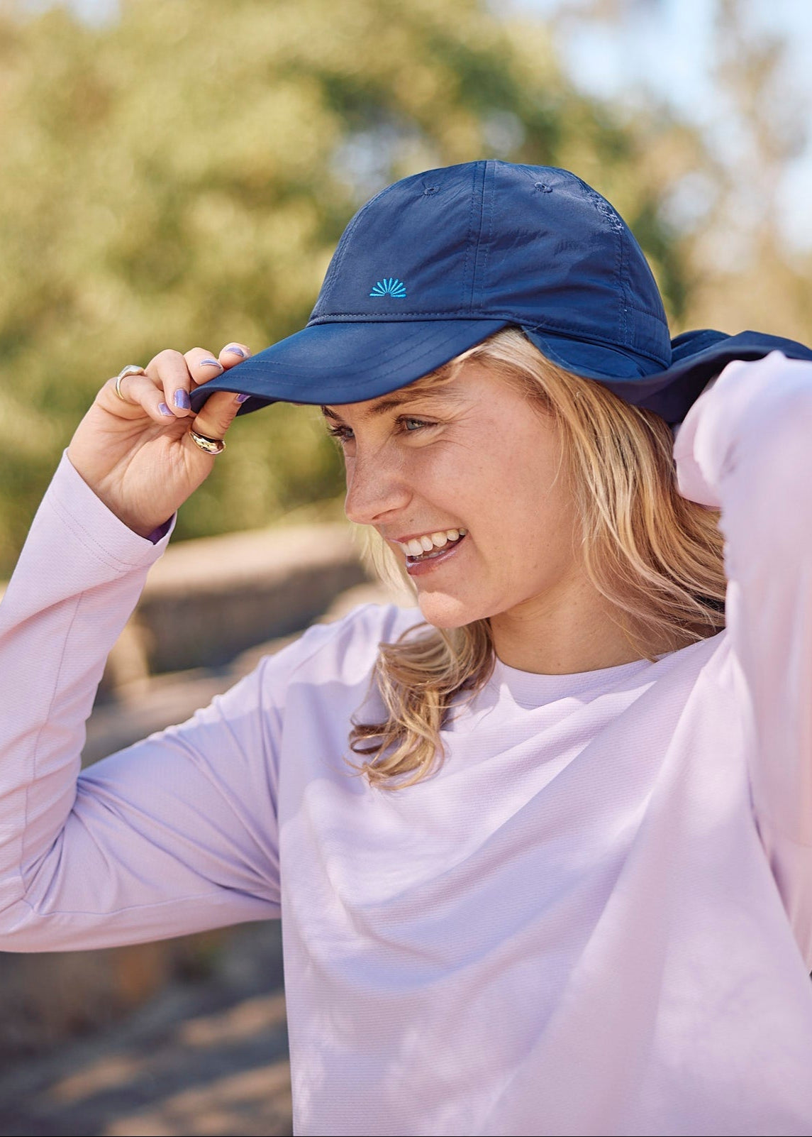 A sun smart woman wears the Sun Ray UPF50+ Sun Protection Clothing All G Long Sleeve Tee lilac boxy fit