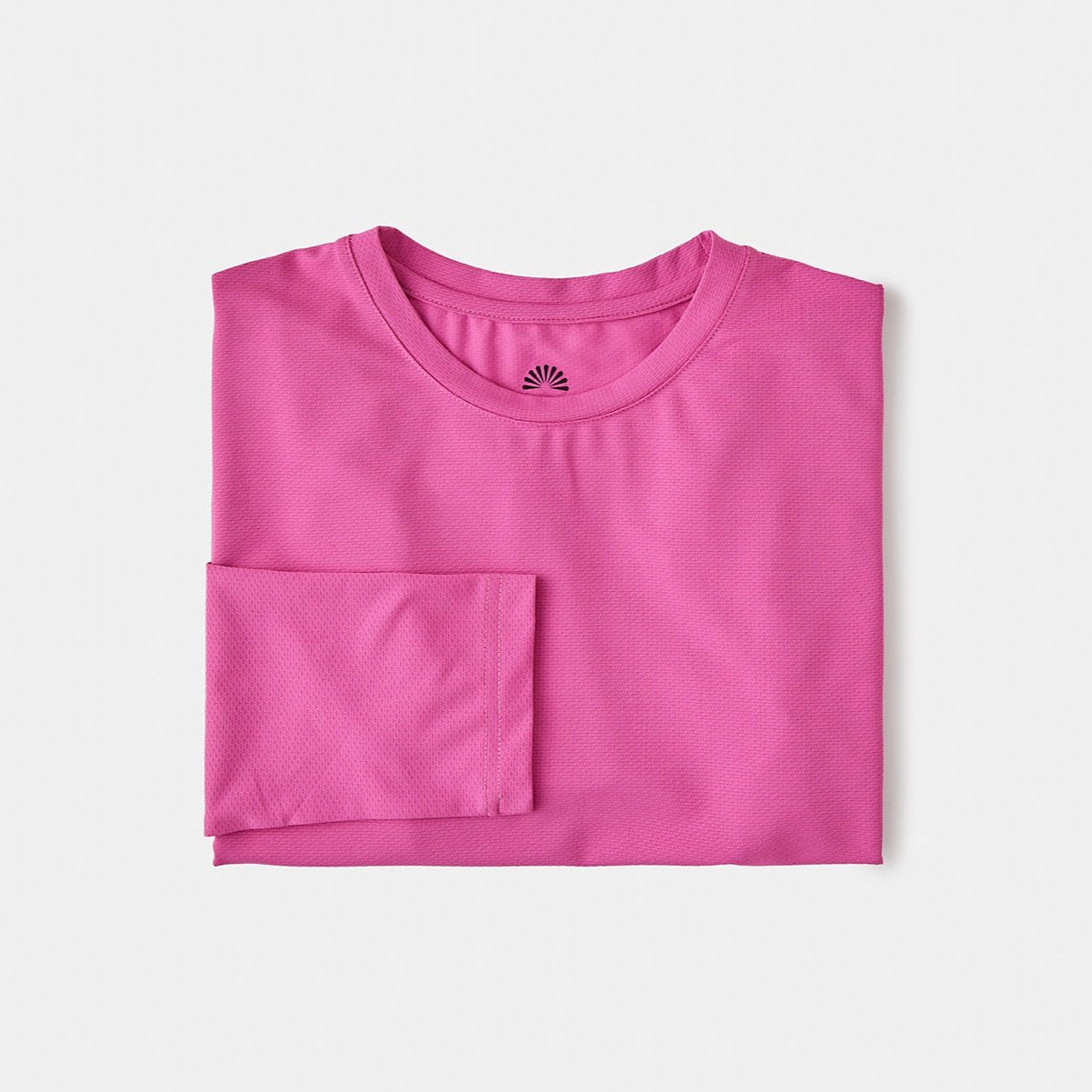 A sun smart woman wears the Sun Ray UPF50+ Sun Protection Clothing All G Long Sleeve Tee fuchsia boxy fit and Shade Cap in Australia