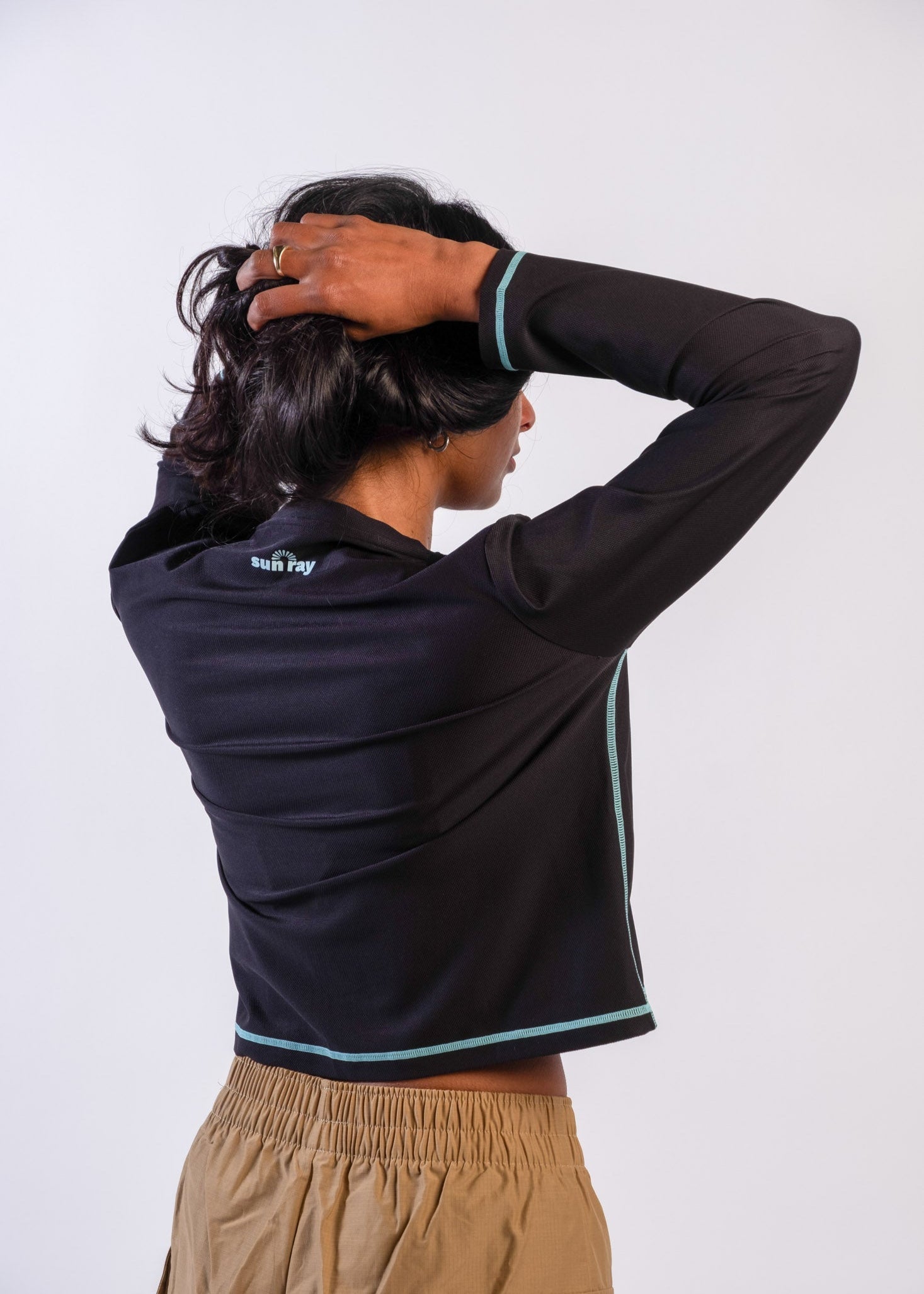 Woman wearing Sun Ray UPF50+ sun protection black long-sleeve top